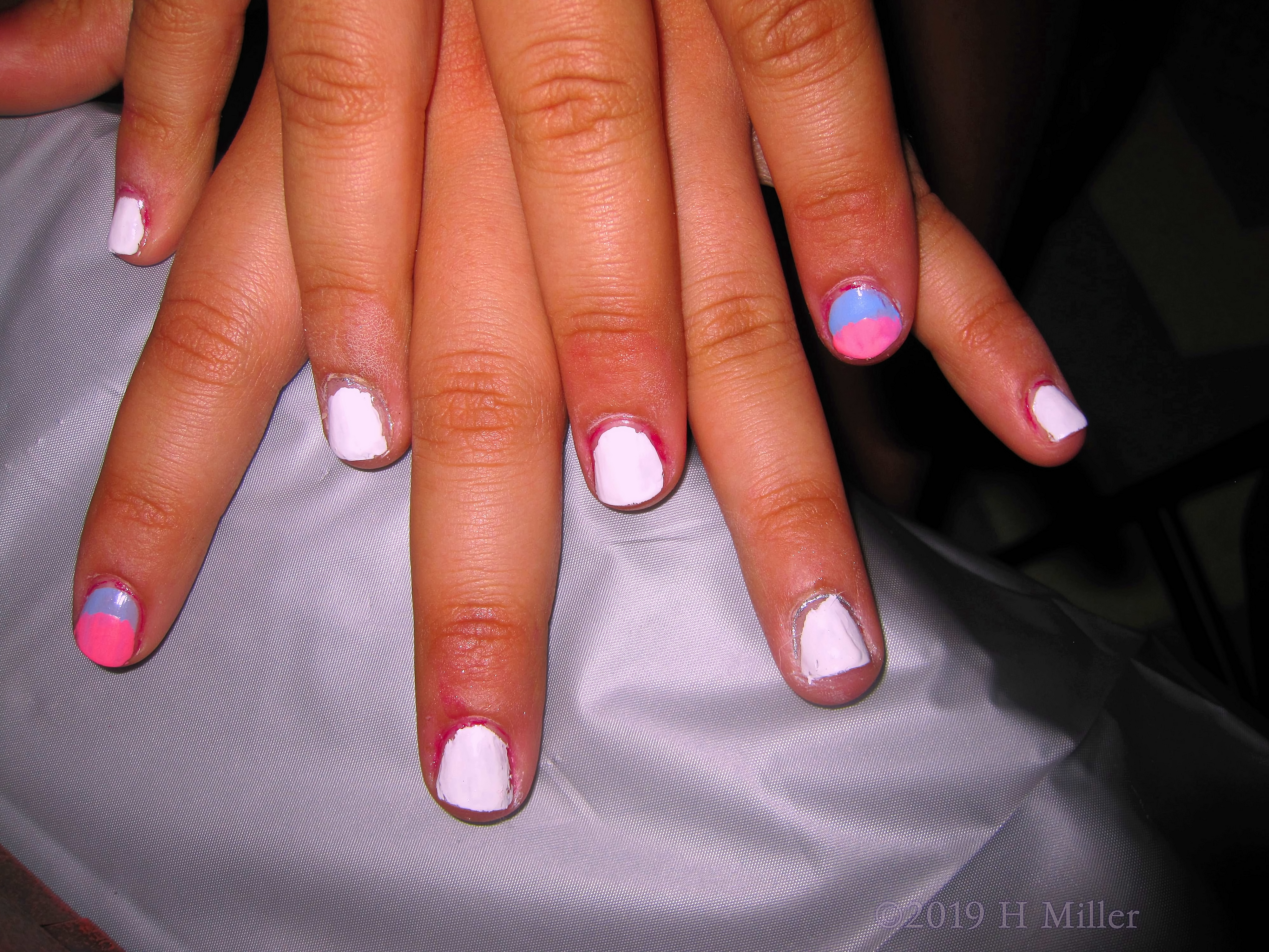 A Pretty Manicure For Girls With Nail Design Of Pink And  Blue Ombre.